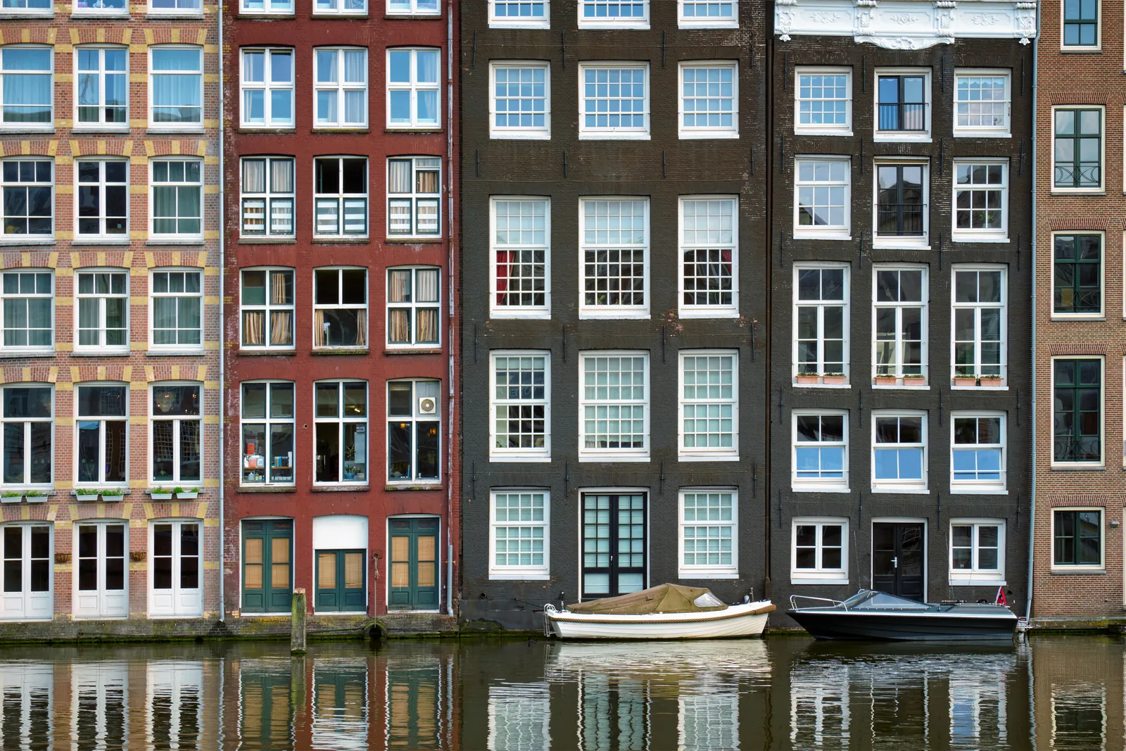 Canal houses on the Damrak in Amsterdam