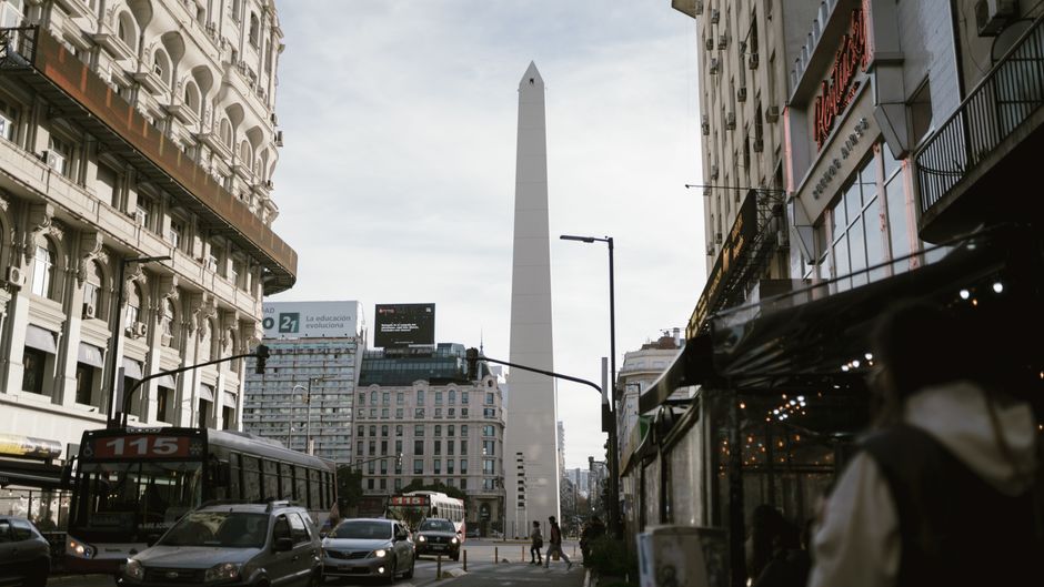 Urban view of Buenos Aires featuring the iconic Obelisk and lively street traffic.