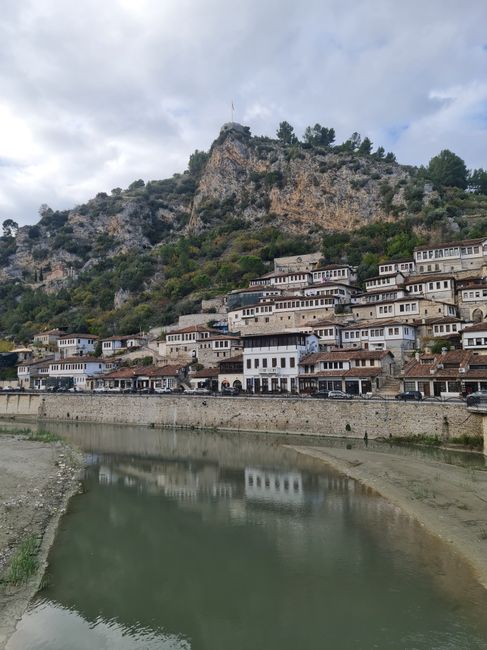 Scenic view of Berat, Albania featuring traditional houses by the Osum River.