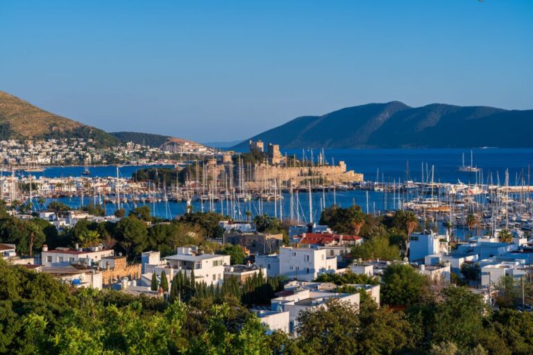 A breathtaking view of Bodrum Castle overlooking the marina and cityscape in Türkiye.