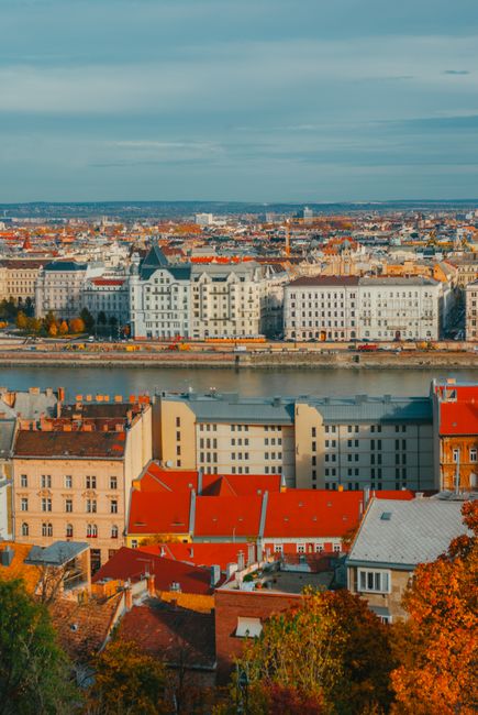 A beautiful aerial view showcasing the vibrant cityscape and architecture of Budapest along the Danube River.