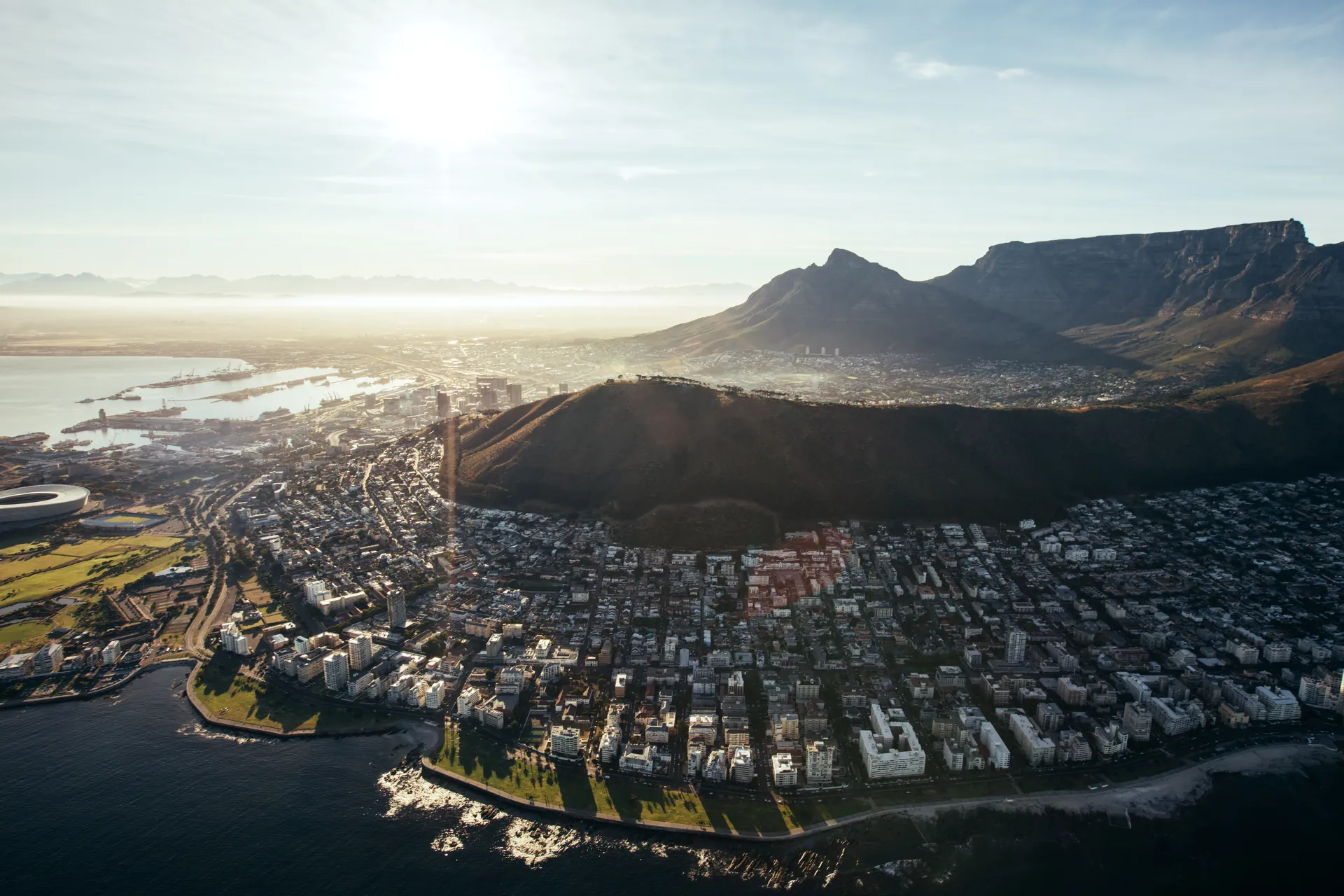 Aerial view of Cape Town, Lion's Head and Table Mountain at golden hour, South Africa