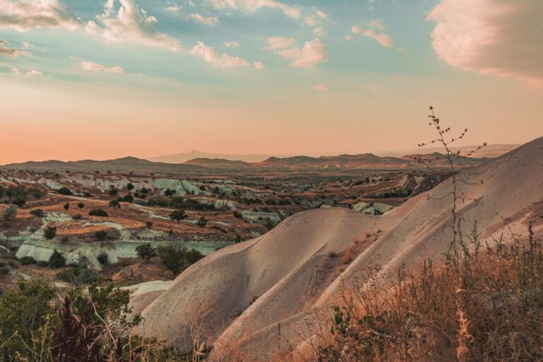 Stunning view of Cappadocia's unique landscapes during sunset in Nevşehir, Turkey.