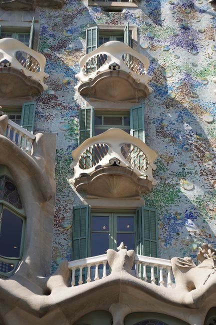 Captivating view of Casa Batlló's ornate facade in Barcelona's vibrant cityscape.