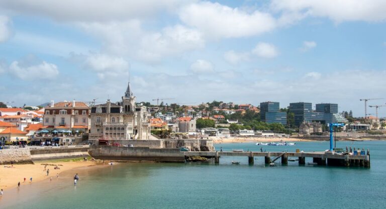 Scenic view of Cascais, Portugal with historic architecture by the beach. Ideal travel destination.