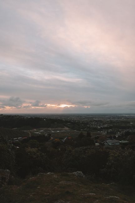 Beautiful view of Christchurch at dusk with a dramatic sky, showcasing the serene New Zealand landscape.