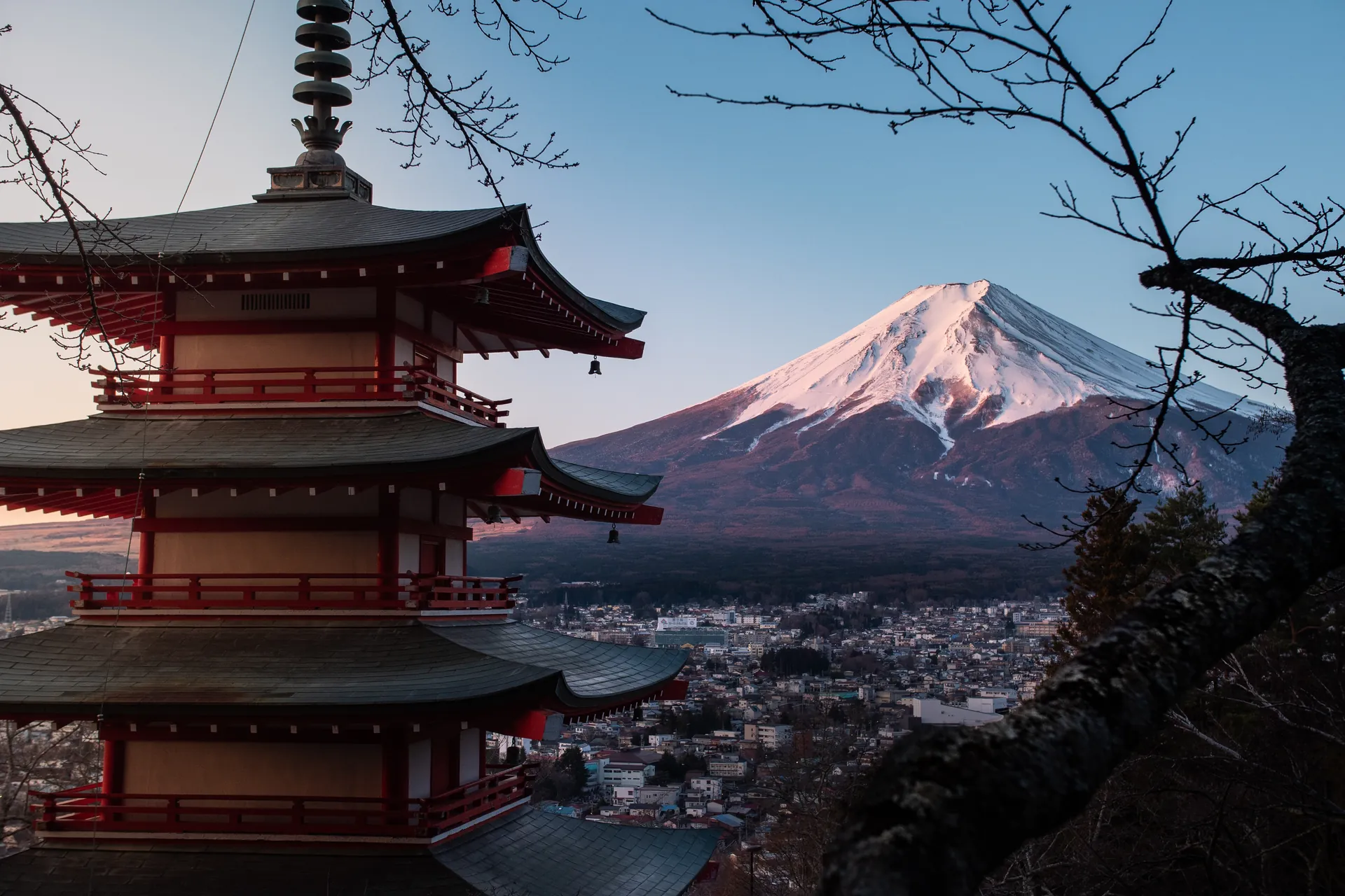 The red Chureito Pagoda with snow-capped Mount Fuji behind it, Fujiyoshida, Japan