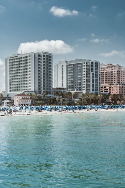 Skyline of Clearwater Beach featuring hotels and blue skies, perfect for vacation travel.