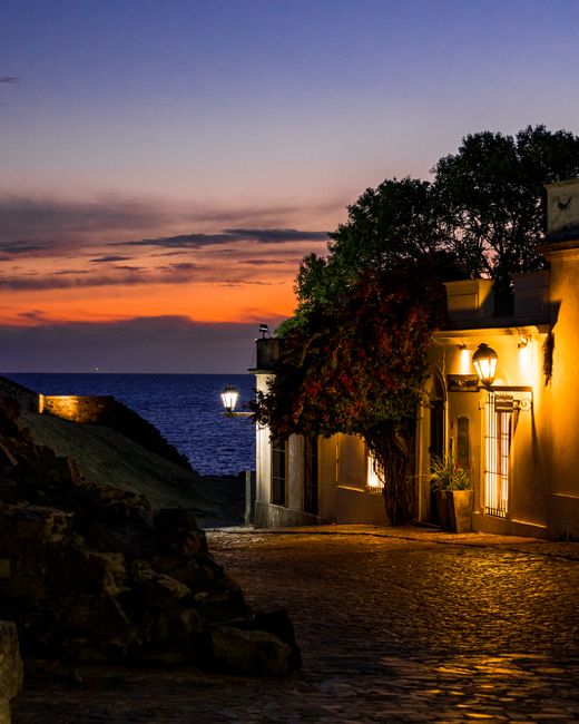 Explore the charming colonial architecture at sunset in Colonia del Sacramento, Uruguay. Ideal for travel enthusiasts.