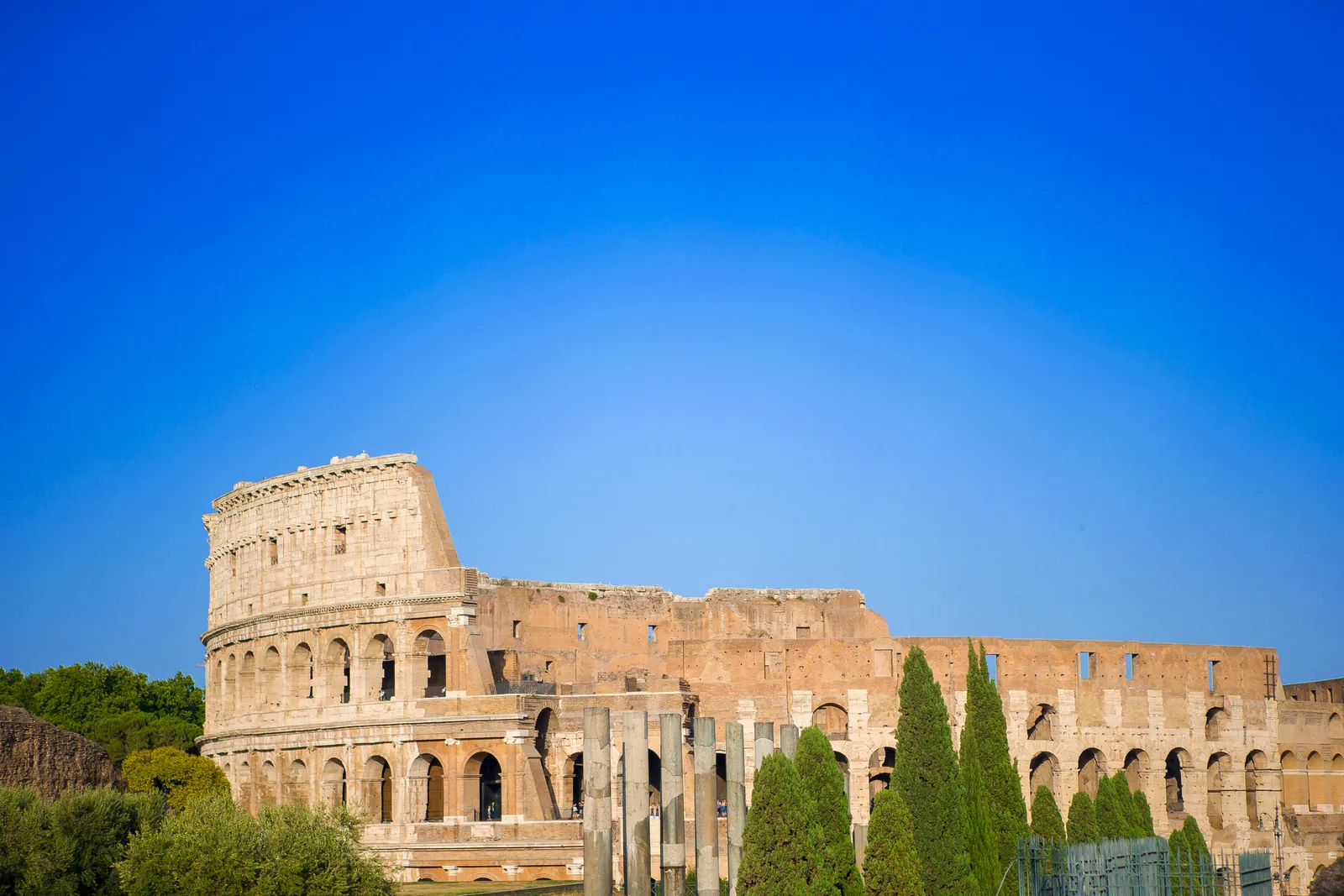The Colosseum under a blue sky in Rome