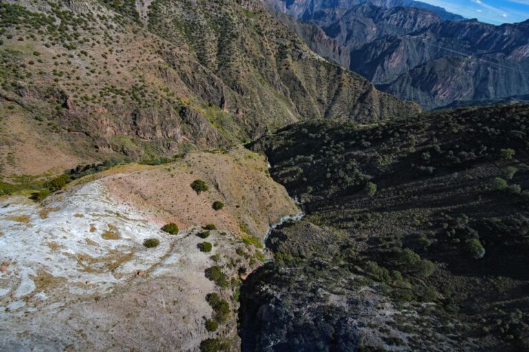 Stunning aerial landscape of Copper Canyon in Mexico showcasing rugged mountains and deep valleys.