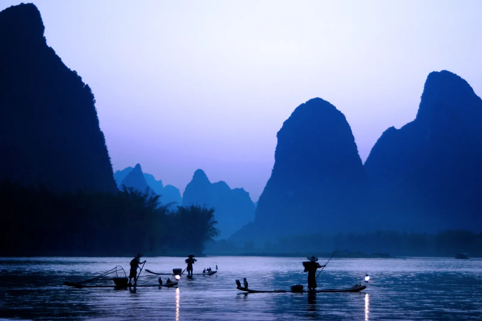 Traditional cormorant fishermen on the river at Guilin, China