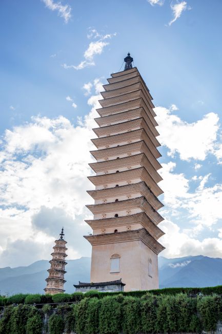 Stunning view of ancient pagodas in Dali, against a clear blue sky, capturing architectural beauty.