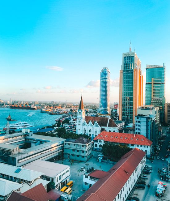 Discover the vibrant skyline and harbor views of Dar es Salaam, Tanzania's largest city.