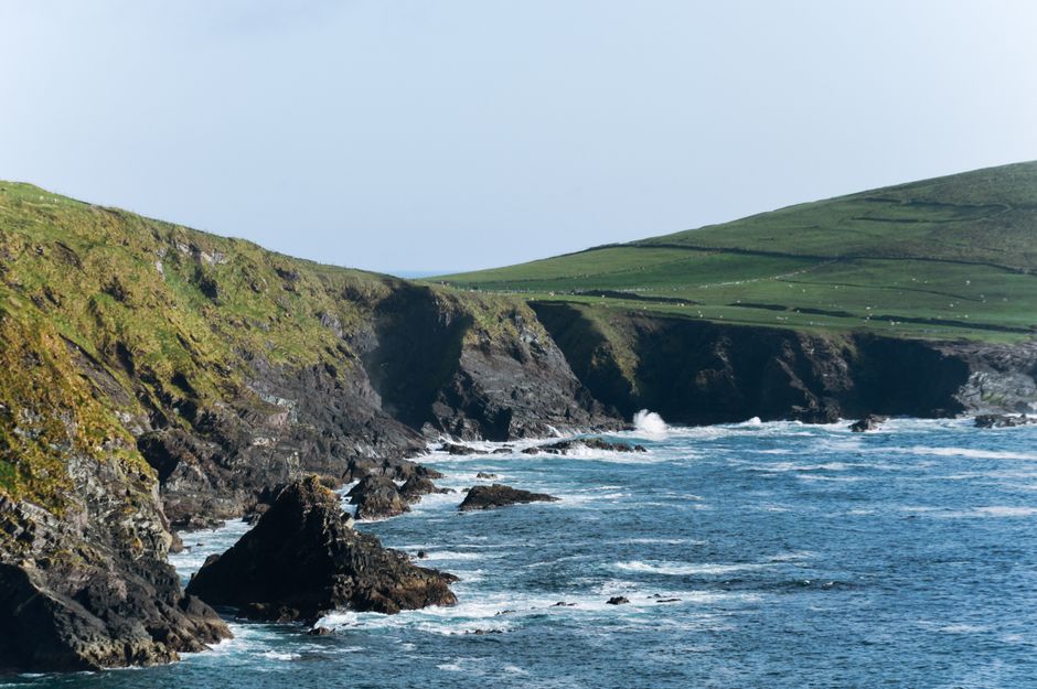 Stunning view of rugged cliffs and ocean waves along the Kerry coastline in Ireland.