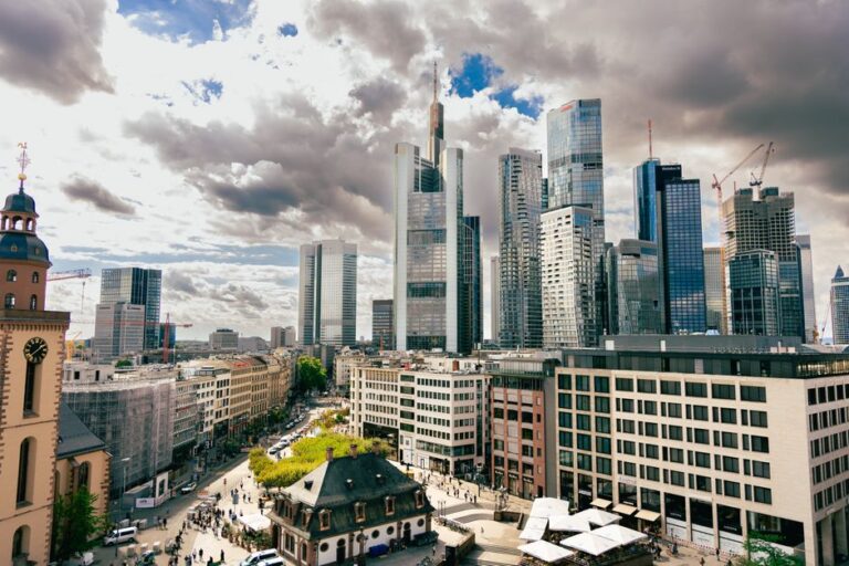 A stunning aerial view of Frankfurt's skyscrapers under dramatic skies. Perfect for business and travel enthusiasts.