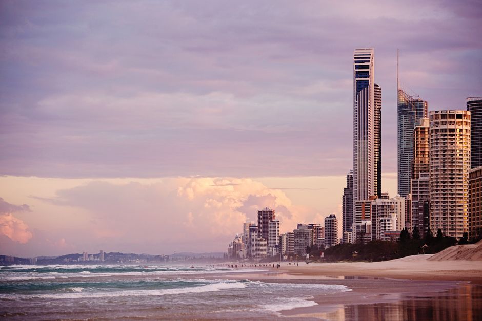 Skyline of Surfers Paradise at sunrise with skyscrapers overlooking the beach in Gold Coast, Australia.