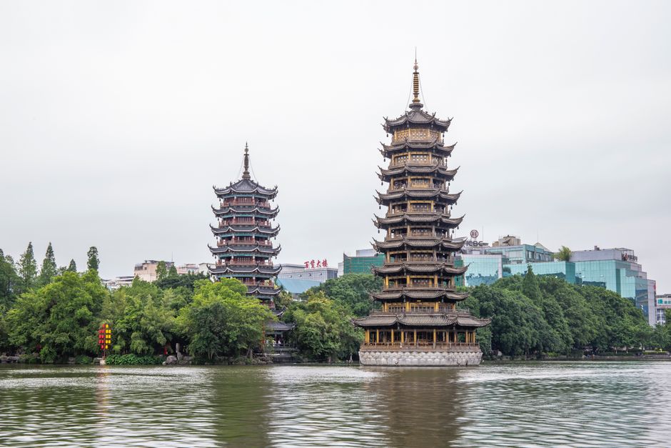 Stunning view of pagodas by the serene Shanhu Lake in Guilin, China.