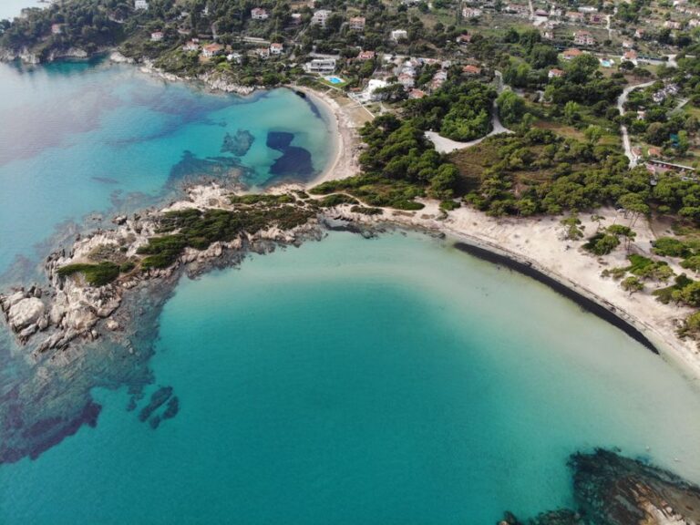 Discover the stunning beaches and vibrant sea of Sithonia, Halkidiki, Greece from above.
