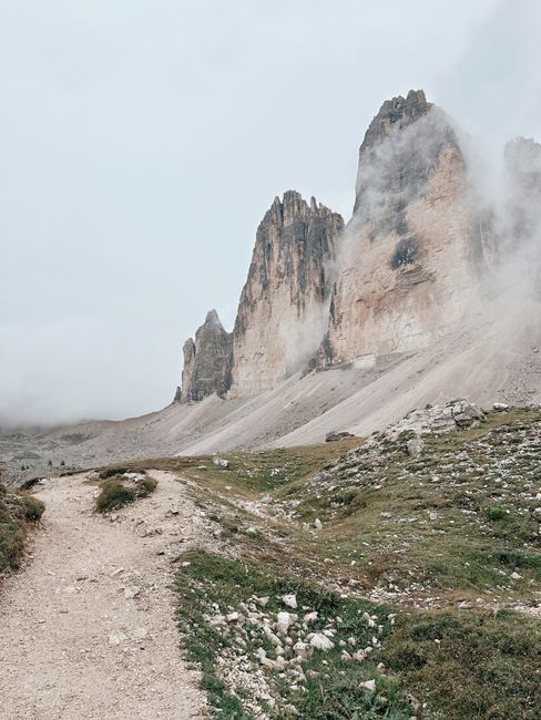 Majestic view of Tre Cime di Lavaredo with misty peaks in Italy.