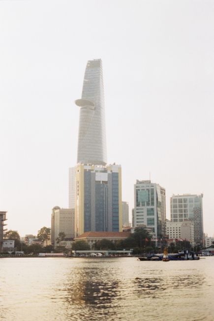 Skyline view of Bitexco Financial Tower and Saigon River in Ho Chi Minh City.