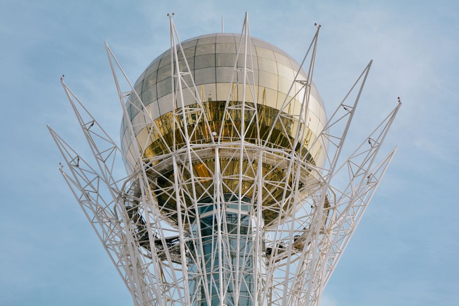 Close-up view of the iconic Baiterek Tower in Astana, Kazakhstan on a clear day.