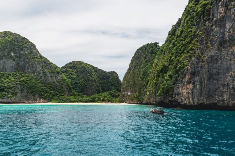 Beautiful coastal view of limestone cliffs and turquoise waters in Phuket, Thailand, perfect for travel inspiration.