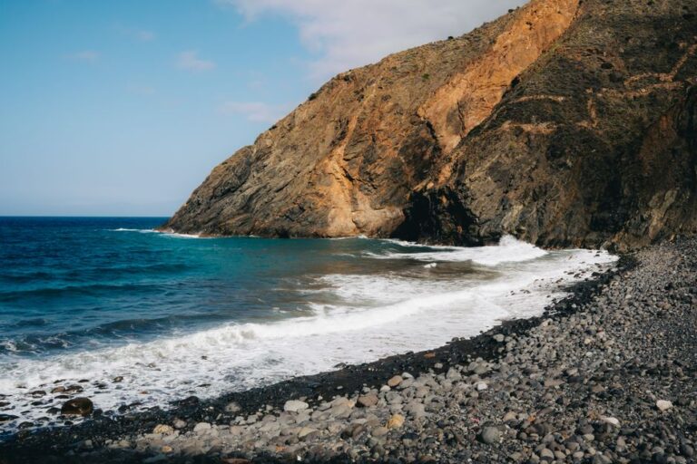 Explore the rugged beauty of Vallehermoso's volcanic cliffs and wild coastline in La Gomera, Canary Islands.