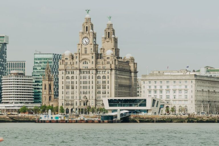 Scenic view of Liverpool's Royal Liver Building at the waterfront, showcasing architectural elegance.