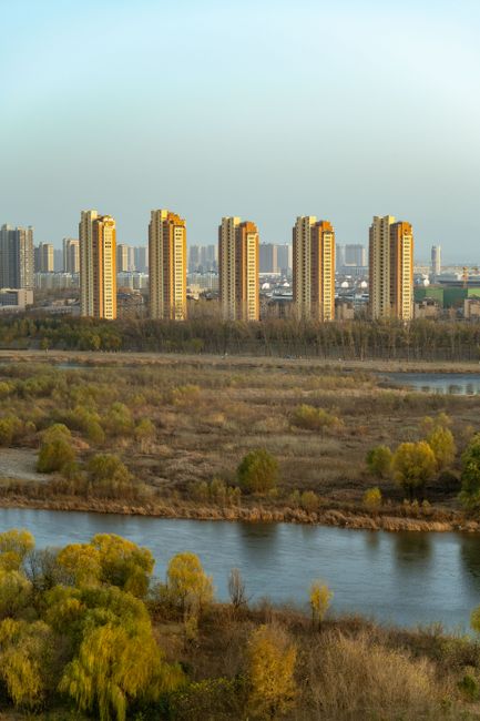 Scenic view of Luoyang cityscape with high-rise buildings and the Luo River.