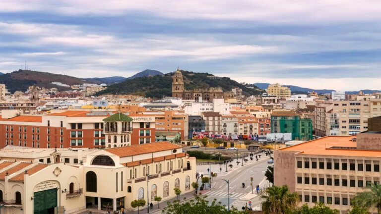 Explore the vibrant cityscape of Málaga featuring historic architecture and modern buildings.