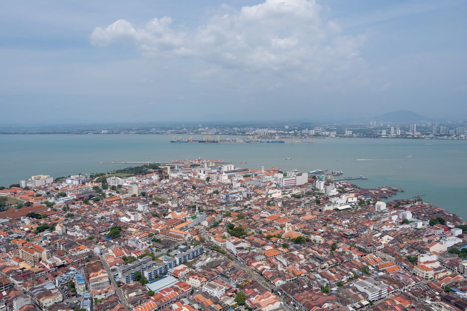 A breathtaking aerial view of Georgetown, Penang highlighting the urban landscape and coastline.