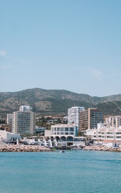 Vibrant coastal shot of Marbella with blue skies and architecture.