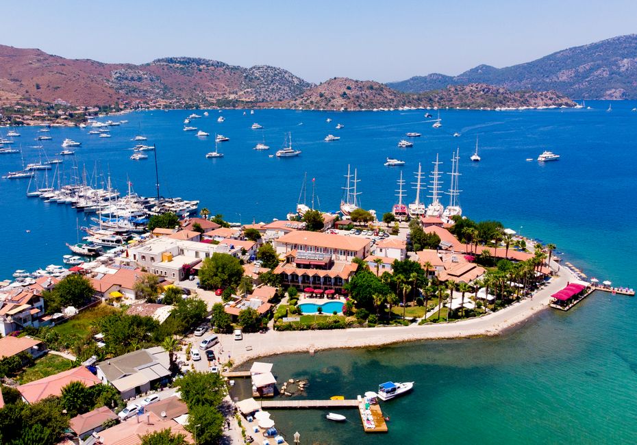 Stunning aerial photo of Marmaris marina with yachts and blue waters.