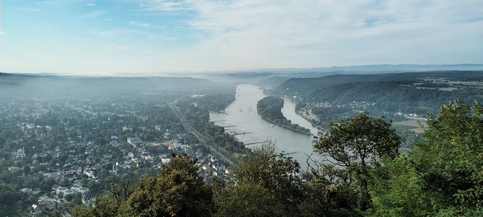A scenic aerial view of Bonn, Germany, showcasing the cityscape and the Rhine River.