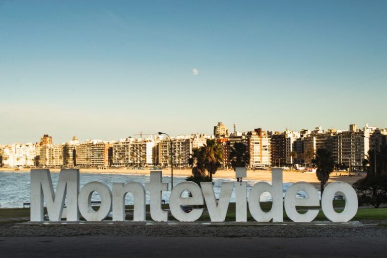 Montevideo landmark sign with city skyline and beach view, capturing Uruguay's iconic coastal urban setting.