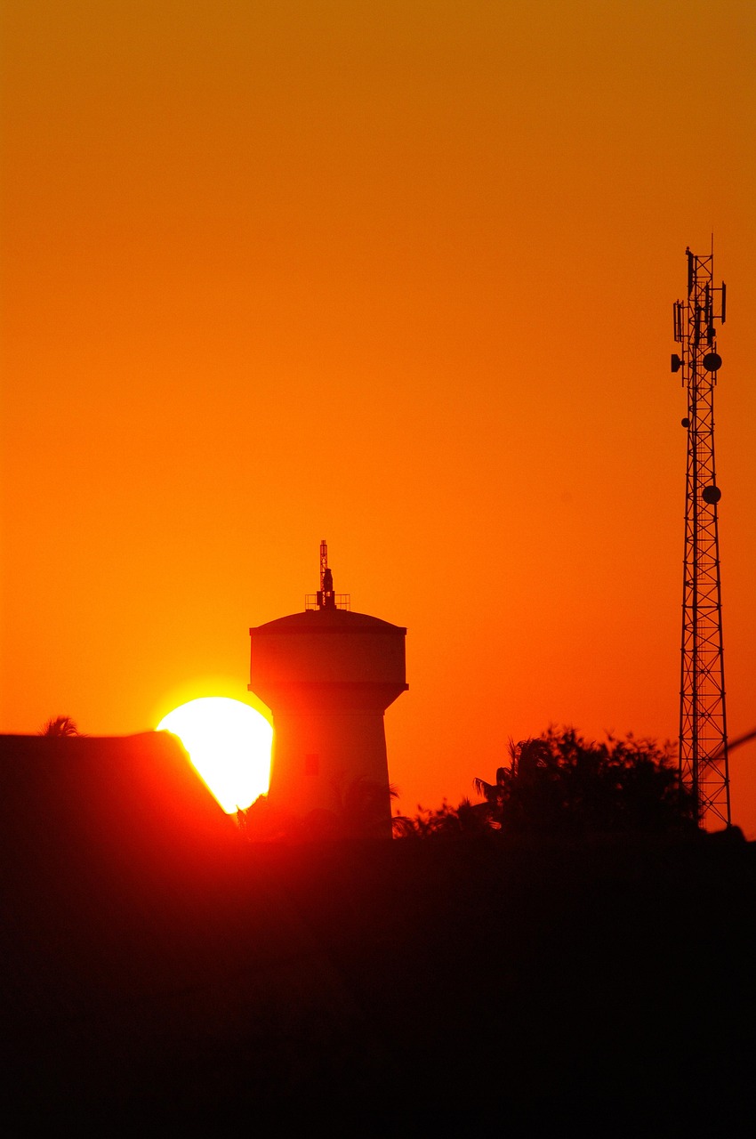Water tower, radio tower, sunset, silhouette, orange, sun, nature, madagascar, morondava, landscape, tropical, hot, scenic, majestic, sky, orange sky, orange water, orange sun, orange landscape, orang
