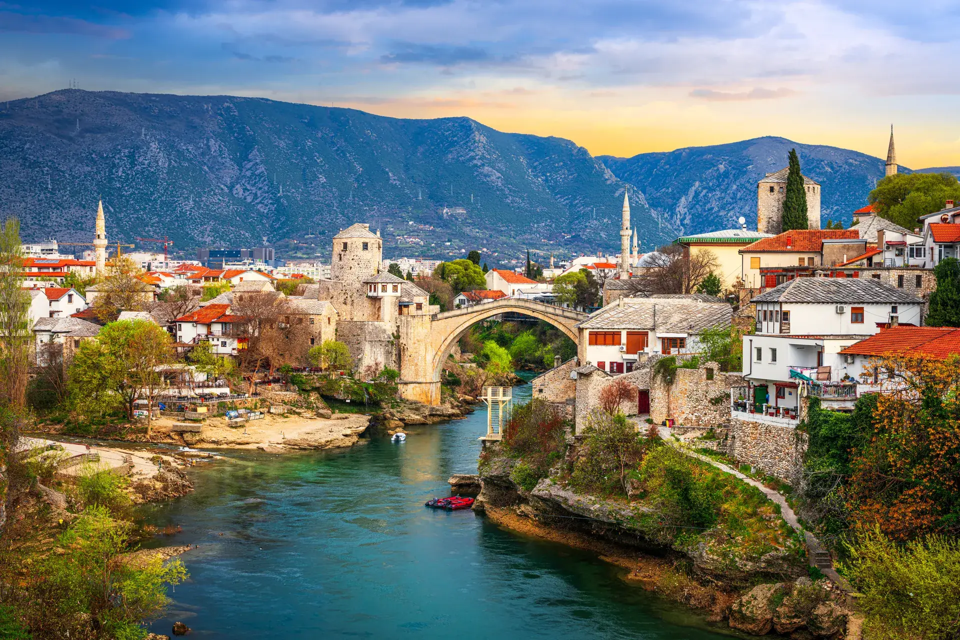 The Old Bridge (Stari Most) over the emerald Neretva River in Mostar at sunset, Bosnia and Herzegovina
