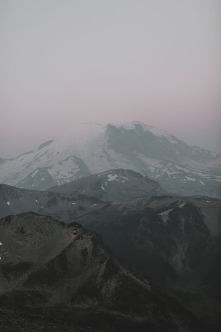 Majestic view of Mount Rainier at dusk with a moody sky in Washington, USA.