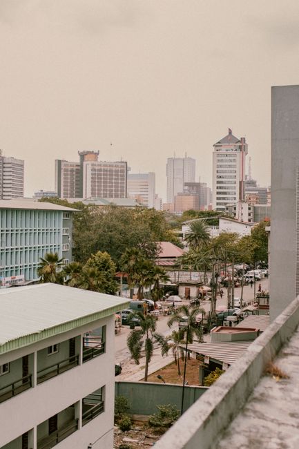 An aerial view of Lagos, Nigeria, showcasing urban architecture and palm trees.
