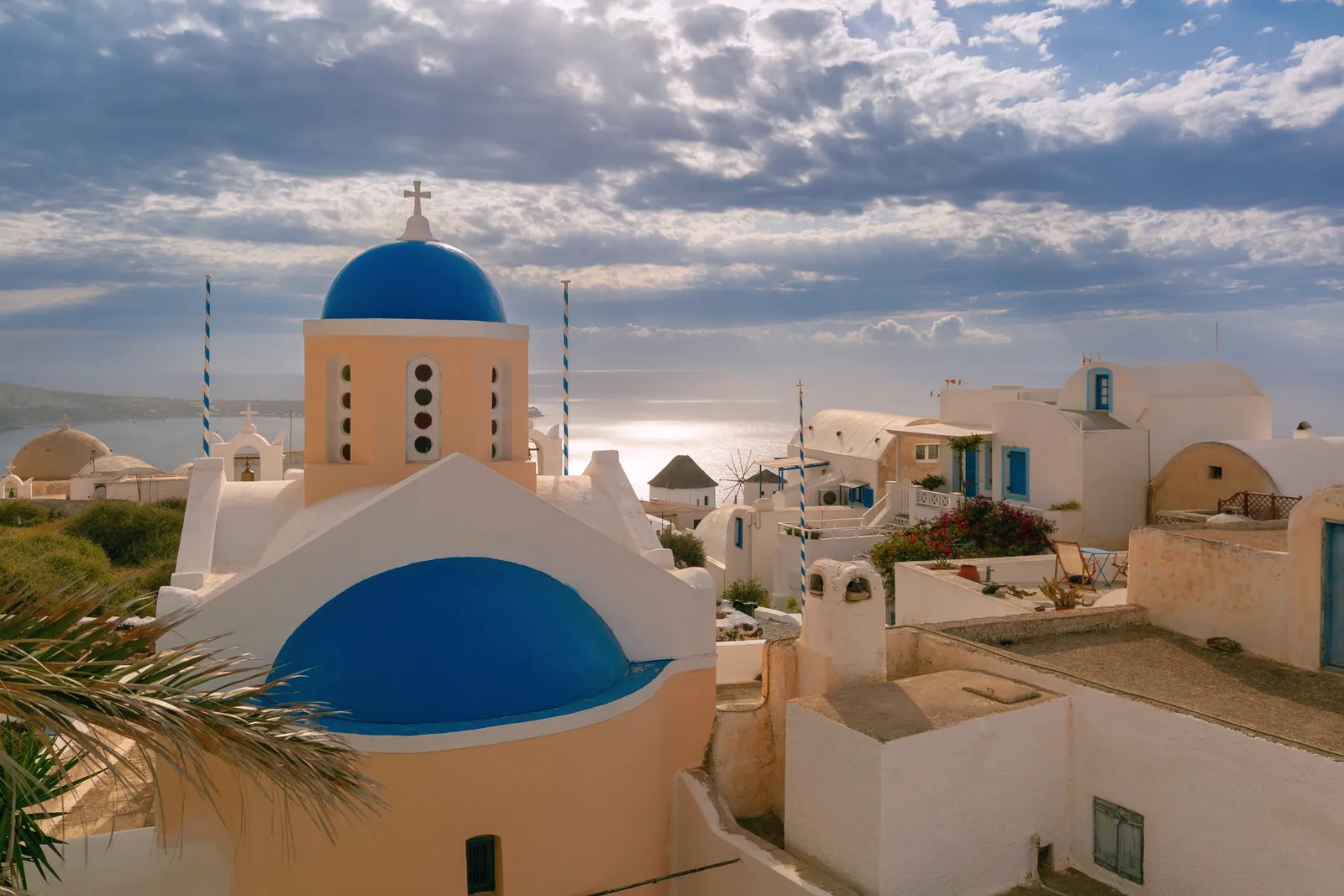 Blue-domed church above the caldera in Oia, Santorini