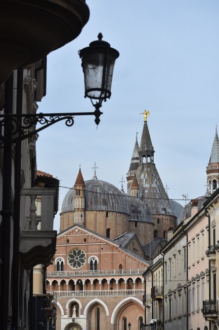 Dramatic shot of the Basilica in Padua, Italy showcasing its iconic domes and detailed architecture.