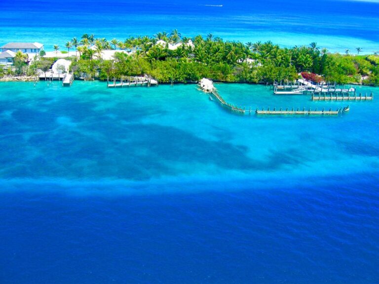 A breathtaking aerial view of Nassau, Bahamas showcasing vibrant blue waters and lush greenery.