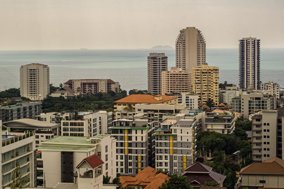 High-rise buildings overlooking the ocean in Pattaya, Thailand, offering a panoramic view.