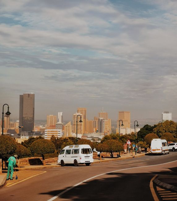 View of Pretoria's skyline with dynamic clouds and busy streets in South Africa.