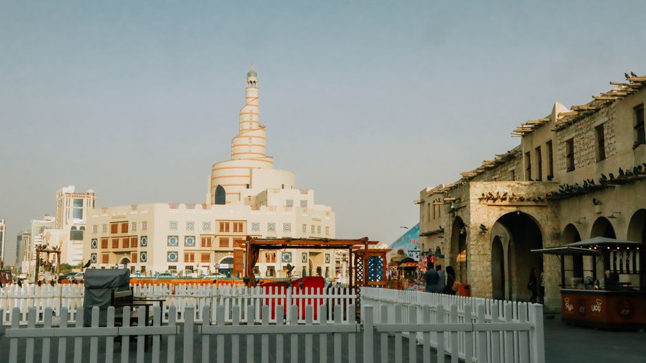 Elegant capture showcasing the iconic spiral mosque and Souq Waqif in Doha’s vibrant setting.