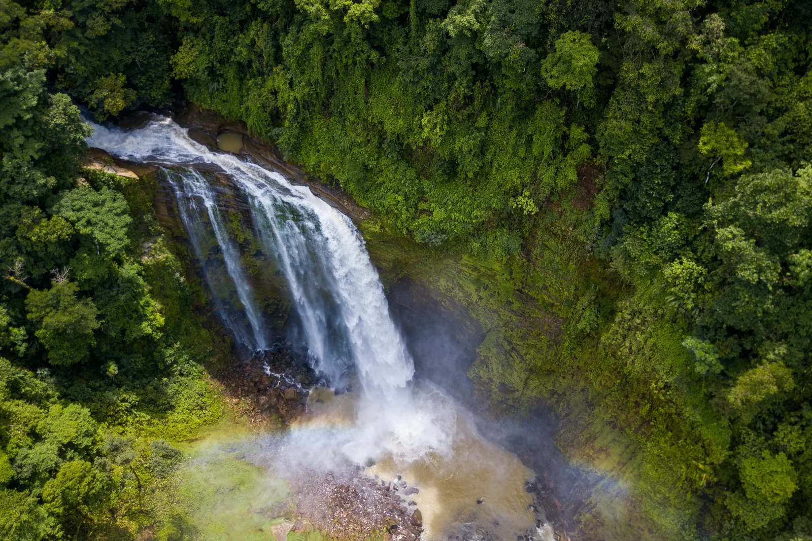 Aerial view of a tall waterfall in the mountain rainforest of Costa Rica