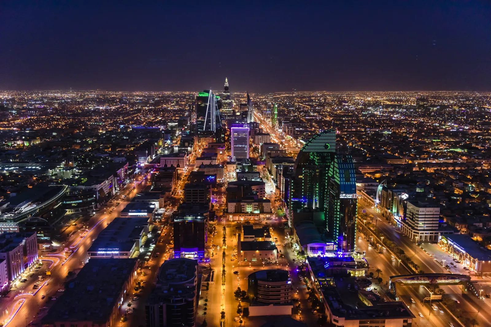 The illuminated streets of Riyadh seen from above at night, Saudi Arabia