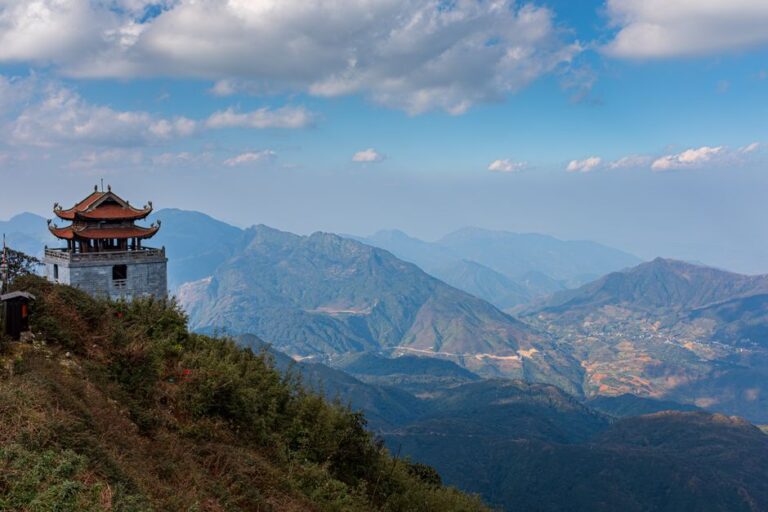 Experience the breathtaking views of Lao Cai mountains with traditional architecture.