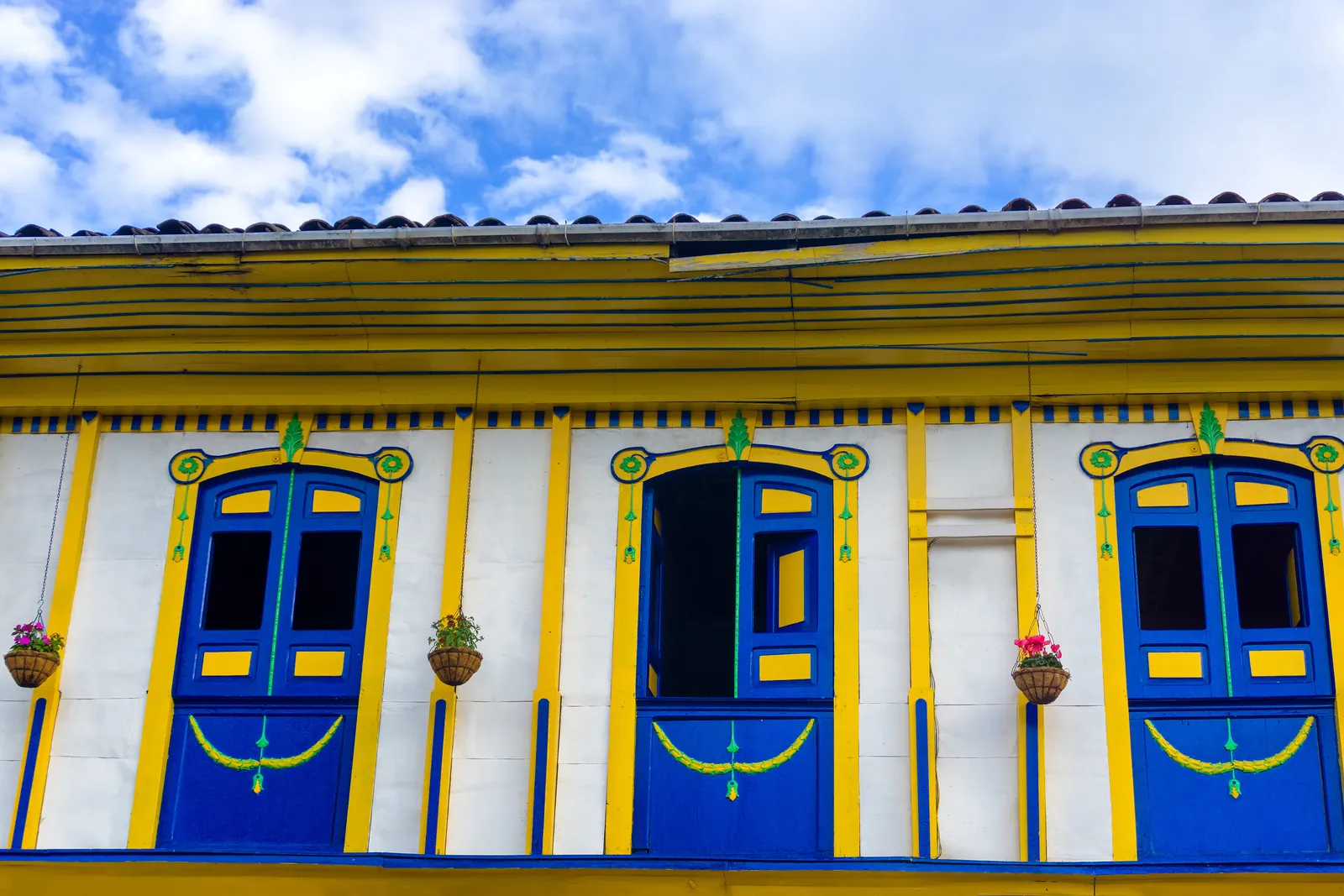 Brightly painted colonial windows in the coffee-region town of Salento, Colombia